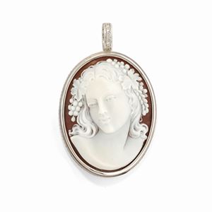 A 18k white gold, cameo and diamond pendant