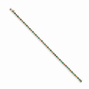 A 14k white gold, emerald and diamond bracelet