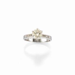 A 14k white gold and diamond ring